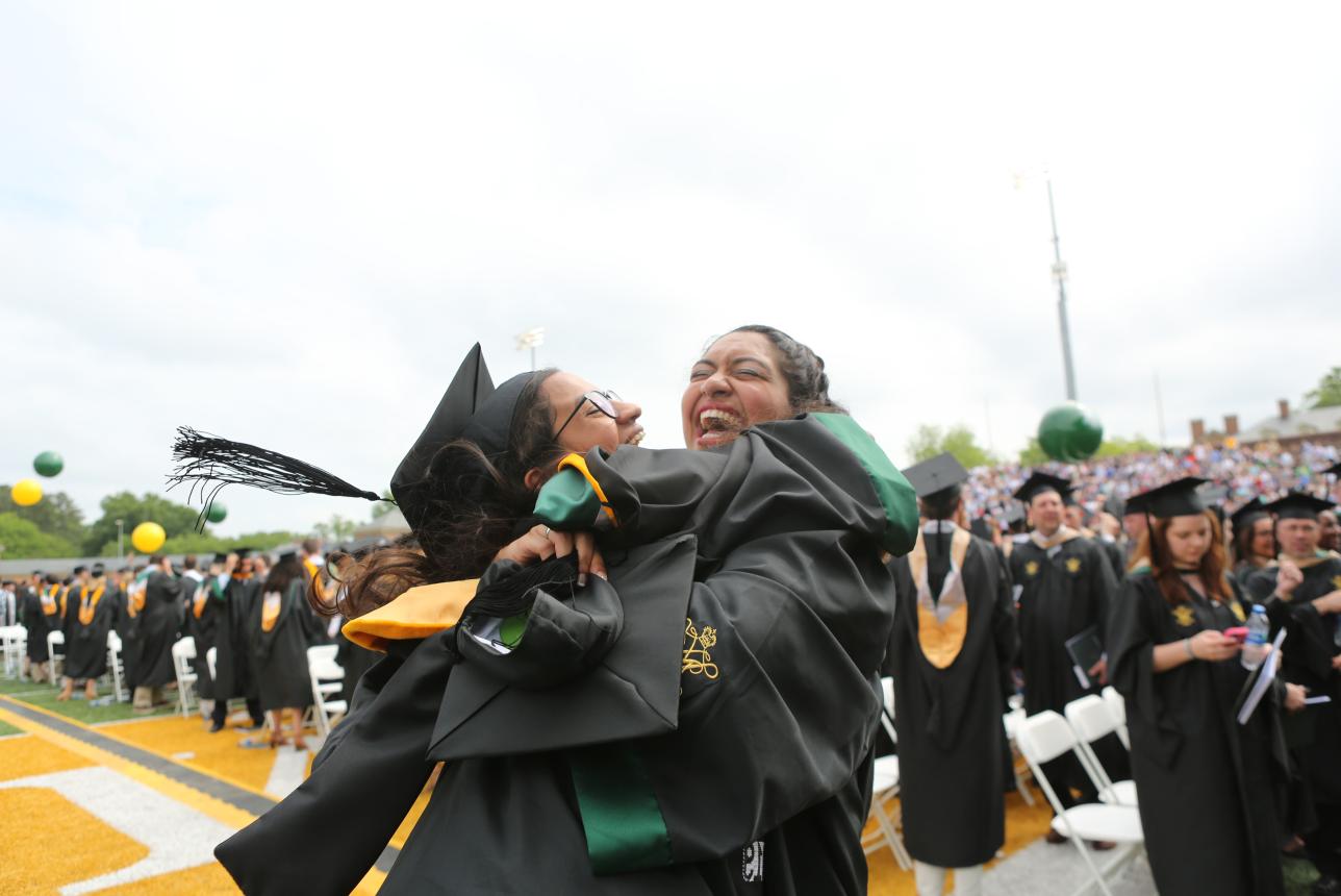 Two William & Mary Students hugging at graduation