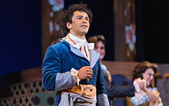 Actors on stage in period dress performing The Scarlet Pimpernel