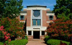 Swem Library in the summer with blooming crepe myrtle trees