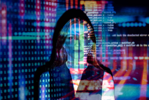 A portrait of a woman with colored lights depicting binary code cast on her face and the background.