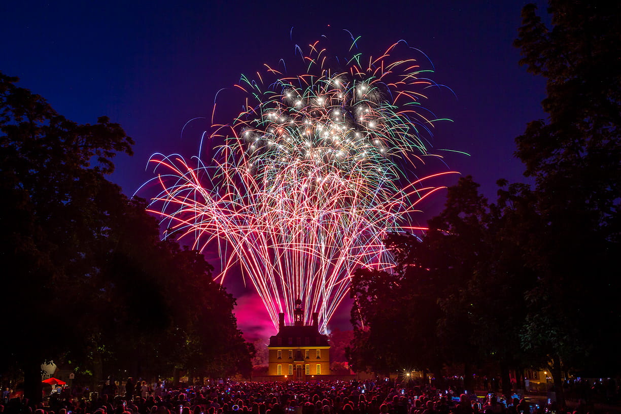 Colorful fireworks on display above the Governor's Palace for a large crowd