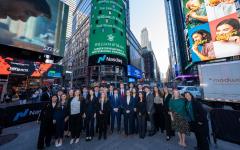 students standing in time square in business attire