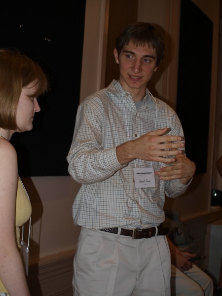 Daniel discussing his research with a fellow student.
