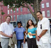 Anthropology graduate students (from left) Chris Crain, Grace Turner and Autumn Barrett with Michael Blakey at the African Burial Ground National Monument in New York on Oct. 5, 2007.