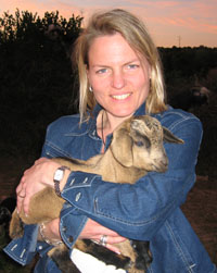 Karen Prentiss Braun '87 in the Atlas Mountains of Morocco, holding a Tamri goat.