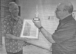 R. Price receiving prize