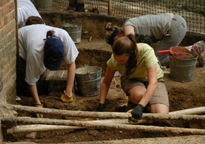  Ashley working around a tangle of utlity lines at the southwest corner of the Brafferton