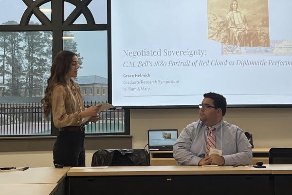 Grace Helmick and Patrick Hussey presenting at Graduate Research Symposium