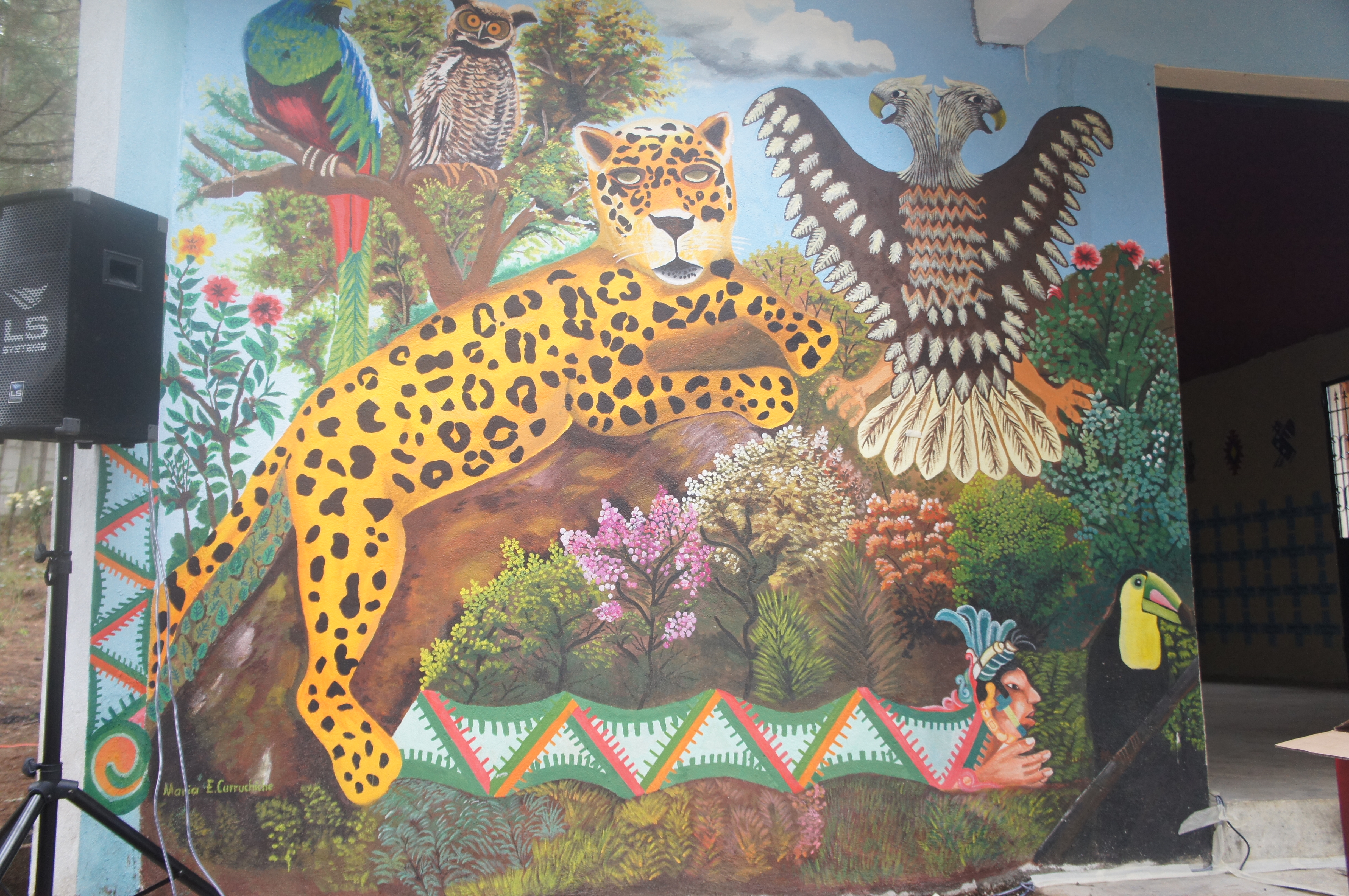 Mural by Maria Elena Curruchiche depicting animals and spirits of the highlands.