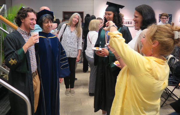 Art History Chair, Sibel Zandi-Sayek and Jordan Wyner with Professor Susan Webster (in background looking on)