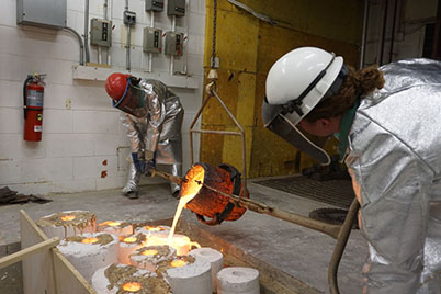 Studio Art students in the midst of a bronze-casting