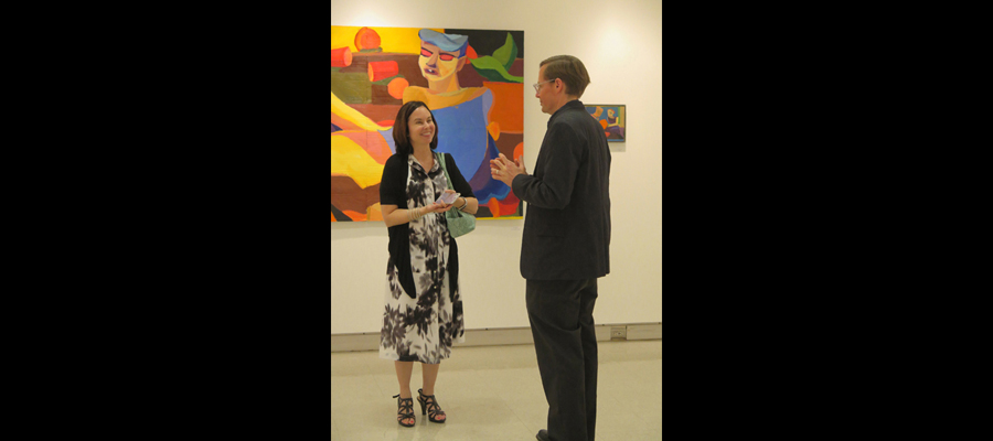 Gallery Senior Show "Color Safari", Prof. Lee and Noah Woodruff's mother in front of Noah's paintings