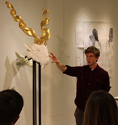 Studio Art & Biology major, Evan Broennimann, '20 presenting his sculpture, "Vigil"  during the 2019 Catron Scholars Reception