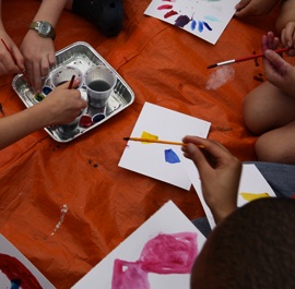 How do we perceive color? Students mix water colors and paint their own color wheel. Photo by Stephen Salpukas