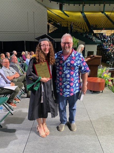 Celeste Philips ’24 (with research mentor, Dr. Mark Forsyth) poses with her Charlotte Preston Mangum Prize plaque at the Biology Graduation Ceremony.