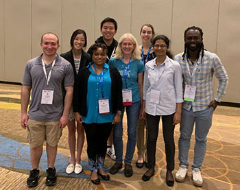 Image 7. Allison and Hinton Labs Duo pose for a picture at the 2019 ASBMB annual meeting. From row: Andy Mattei’19; Ashley Zhang ’20; Dr. Shantá D. Hinton; Dr. Lizabeth A. Allison; Sri Harshini Malapati ’19; Cyril Anyetei-Anum ’16 (B.S.) and ’18 (Master’s), Ph.D. candidate at UNC-Chapel Hill. Back row: Xiaopeng Sun ’19 and Kirstin Reed ’20).