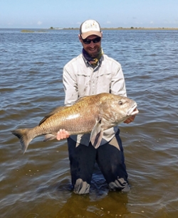 James Skelton with large red drum