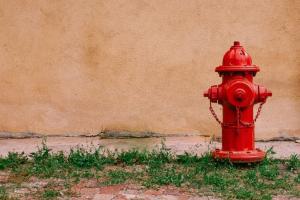 Fire hydrant in front of wall