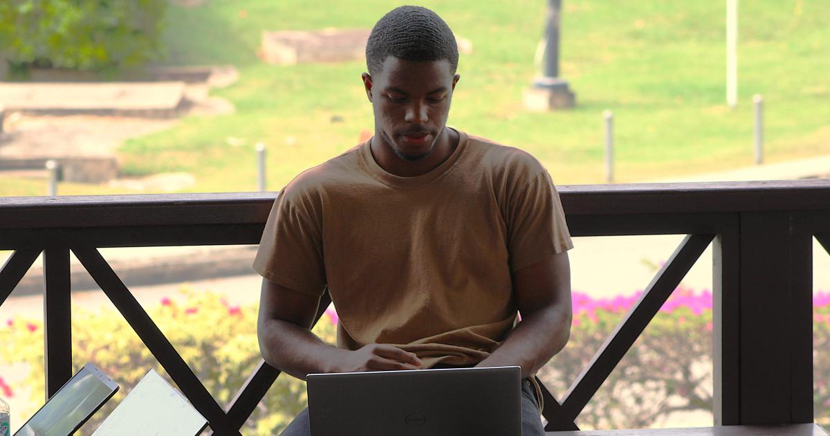 WMSURE researcher Arden Michel '27, a computer science major, joins W&M and UWI undergraduates on the UWI campus last summer in analyzing data collected for the Linguistic Atlas of the Caribbean. (Photo by Anthony "AJ" Joseph)