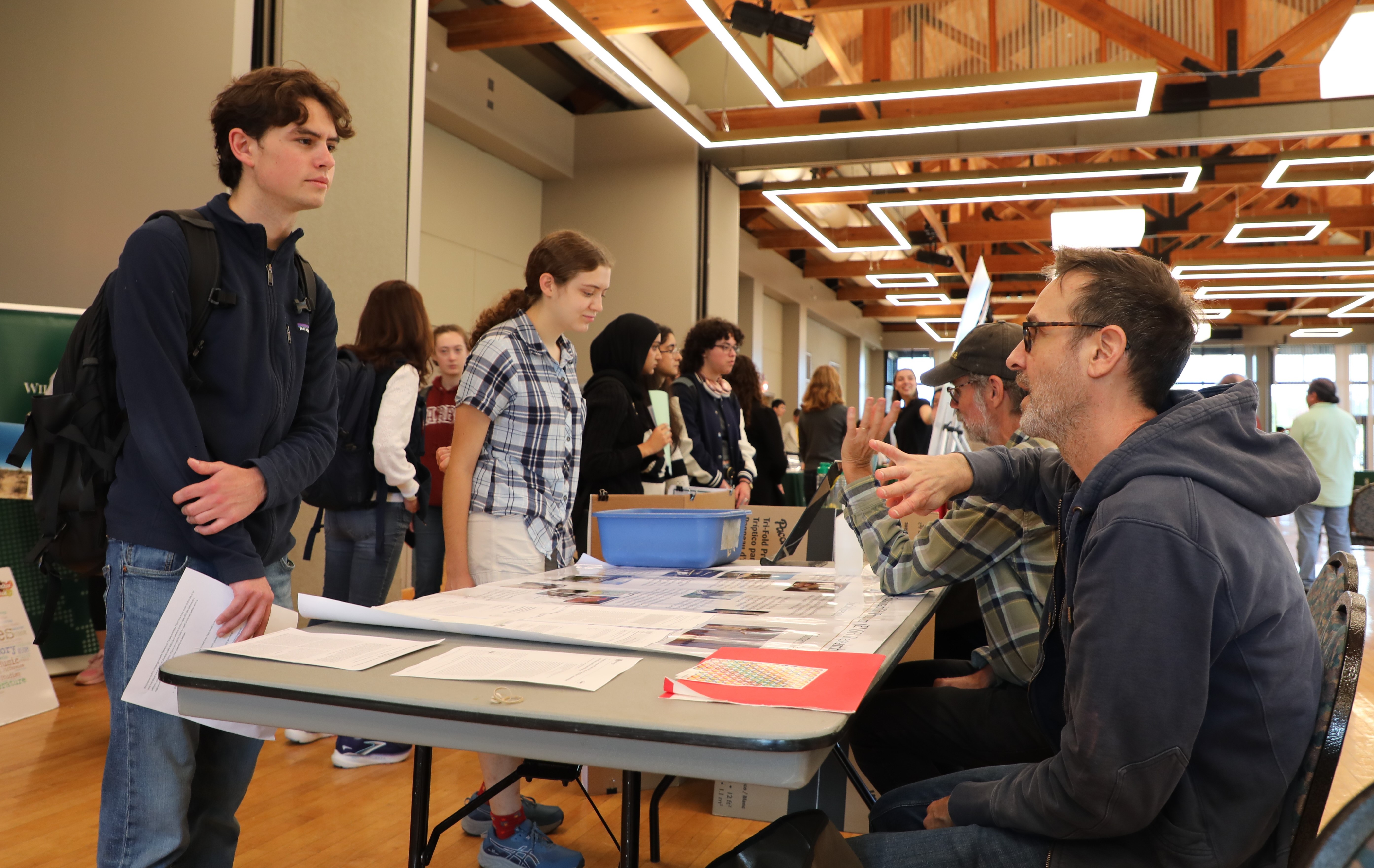 Professor of Sociology and Environment & Sustainability Program Director Brent Kaup (right) discusses research opportunities ranging from studies of turtles and bats to Lyme disease and sustainable business development. (Photo by Adeline Steel)