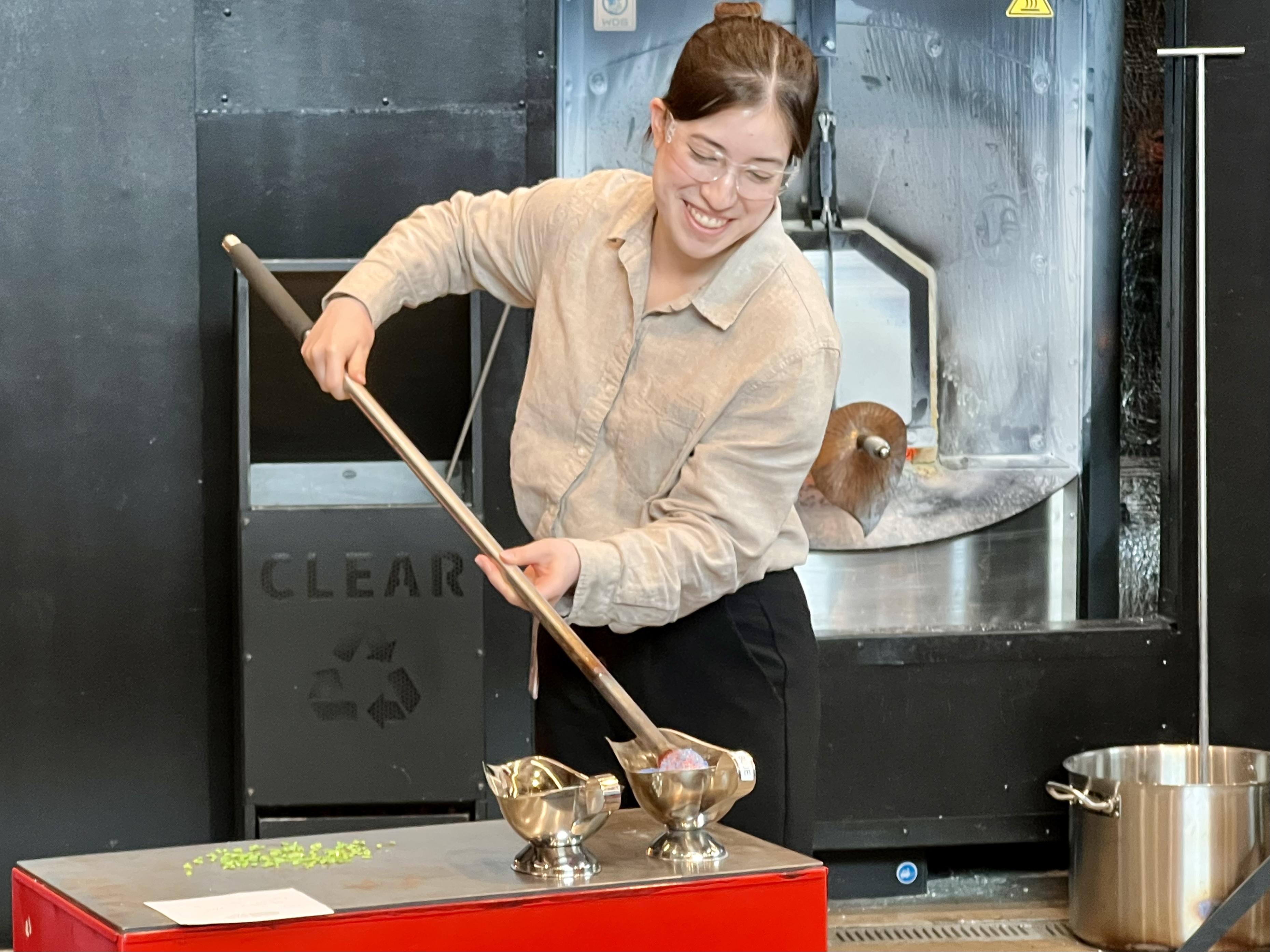 Claire Yee '27 tries her hand at glassmaking during her Woody internship with the Chrysler Museum in Norfolk, Virginia, last summer. (Courtesy photo)