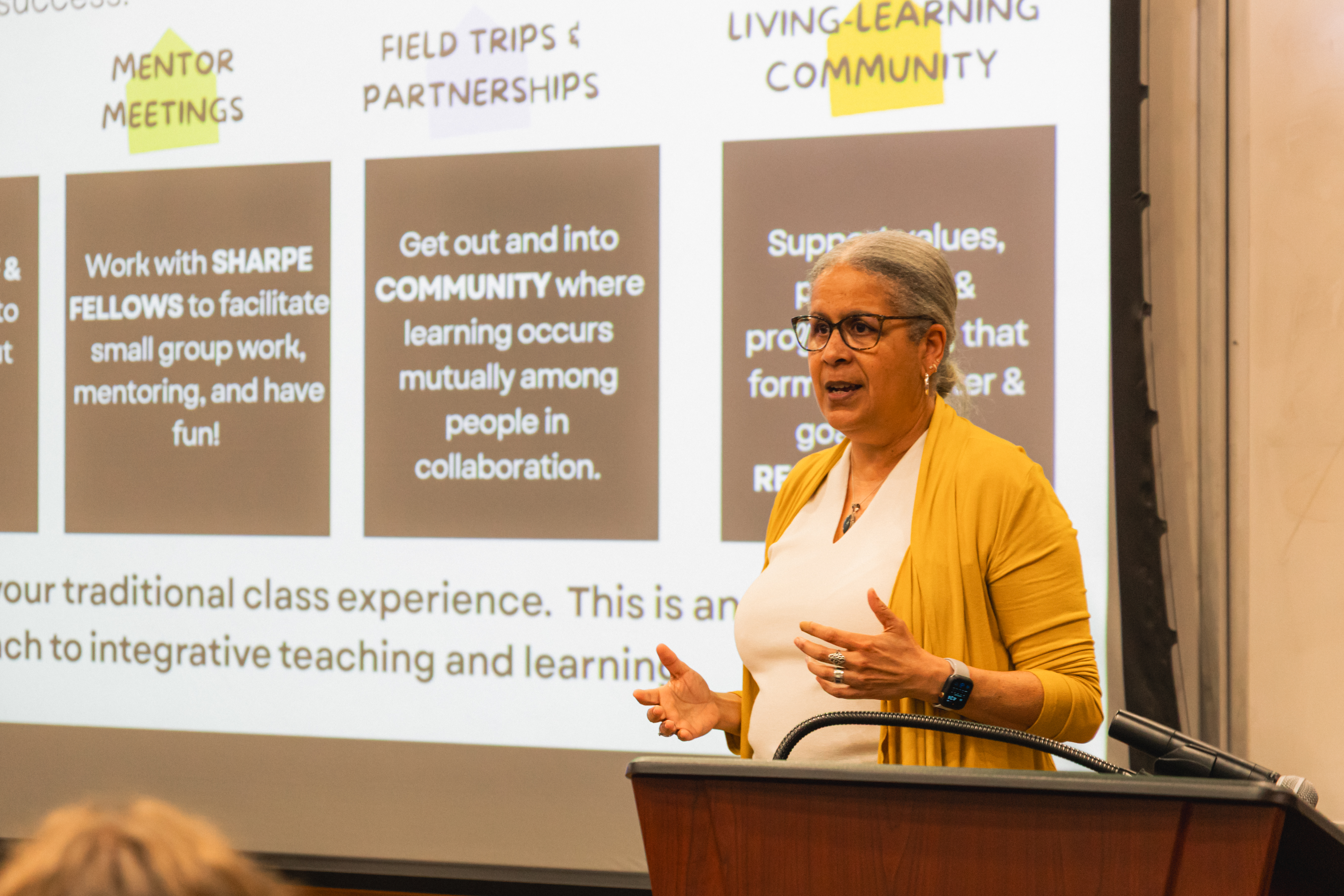 Dr. Monica Griffin ‘88, Director of Engaged Scholarship and the Sharpe Community Scholars Program, welcomes nearly 70 first-year Sharpe Scholars to Tucker Hall Theatre Sept. 4. (Photo by Samuel Li)
