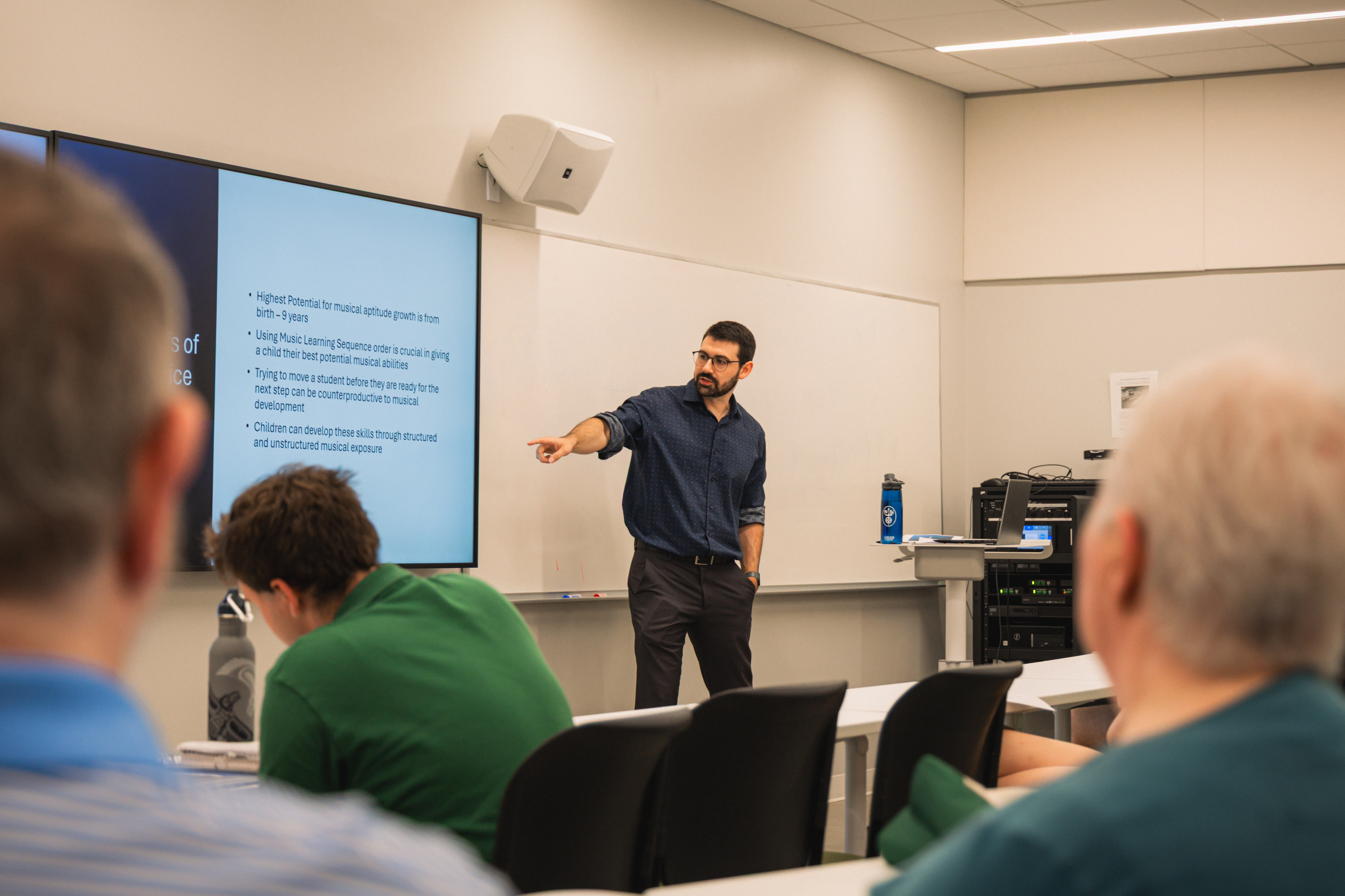 Williams explains the theory behind the multisensory activities that he, his ECMS colleagues, and four Woody Early Childhood Music Education interns bring to life in local Bright Beginnings and Head Start classrooms. (Photo by Samuel Li)