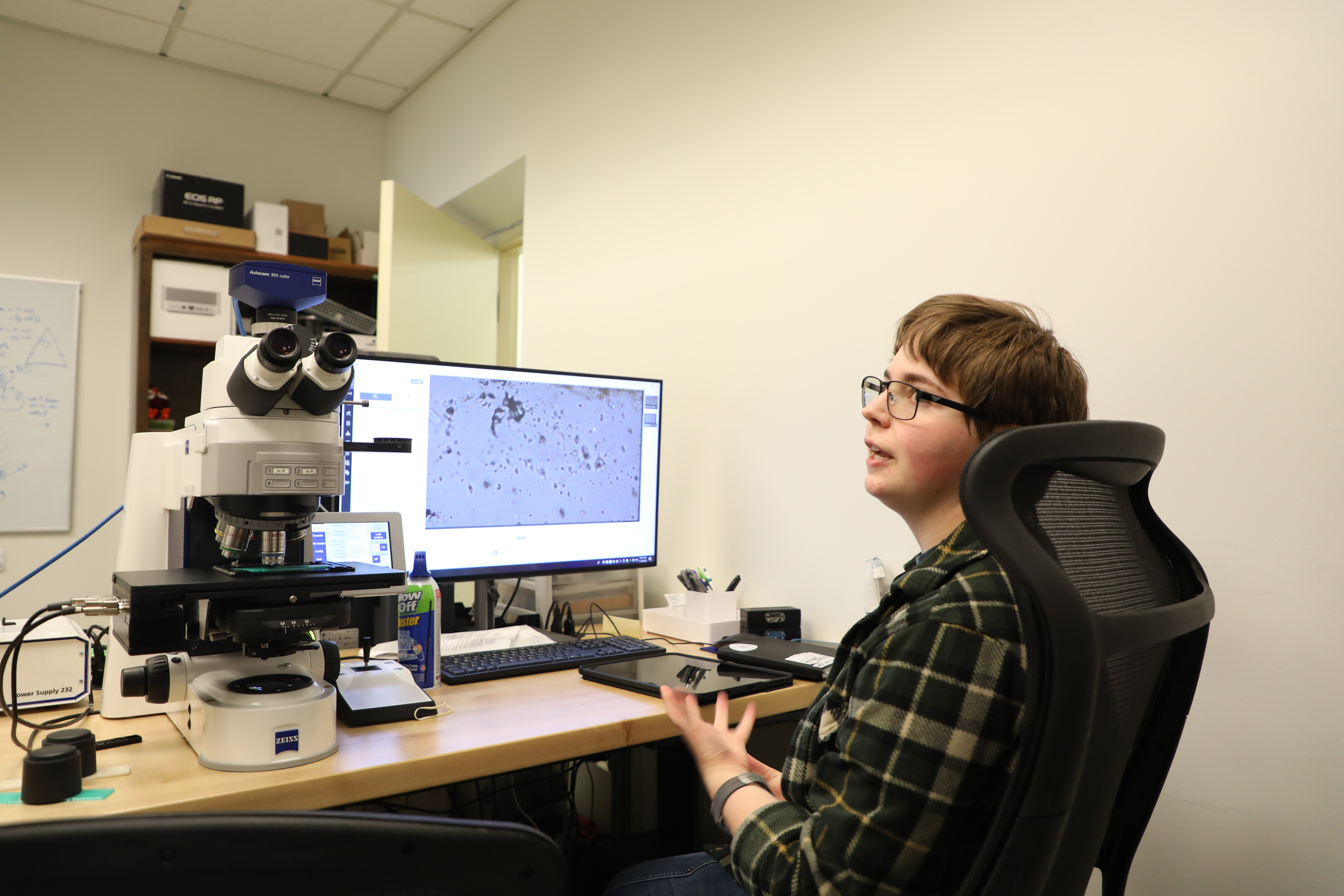 Marina Ashurkoff '26, a geology and English double major, examines quartz crystals found on burial grounds of the enslaved at James Madison's Montpelier. (Photo by Adeline Steel)