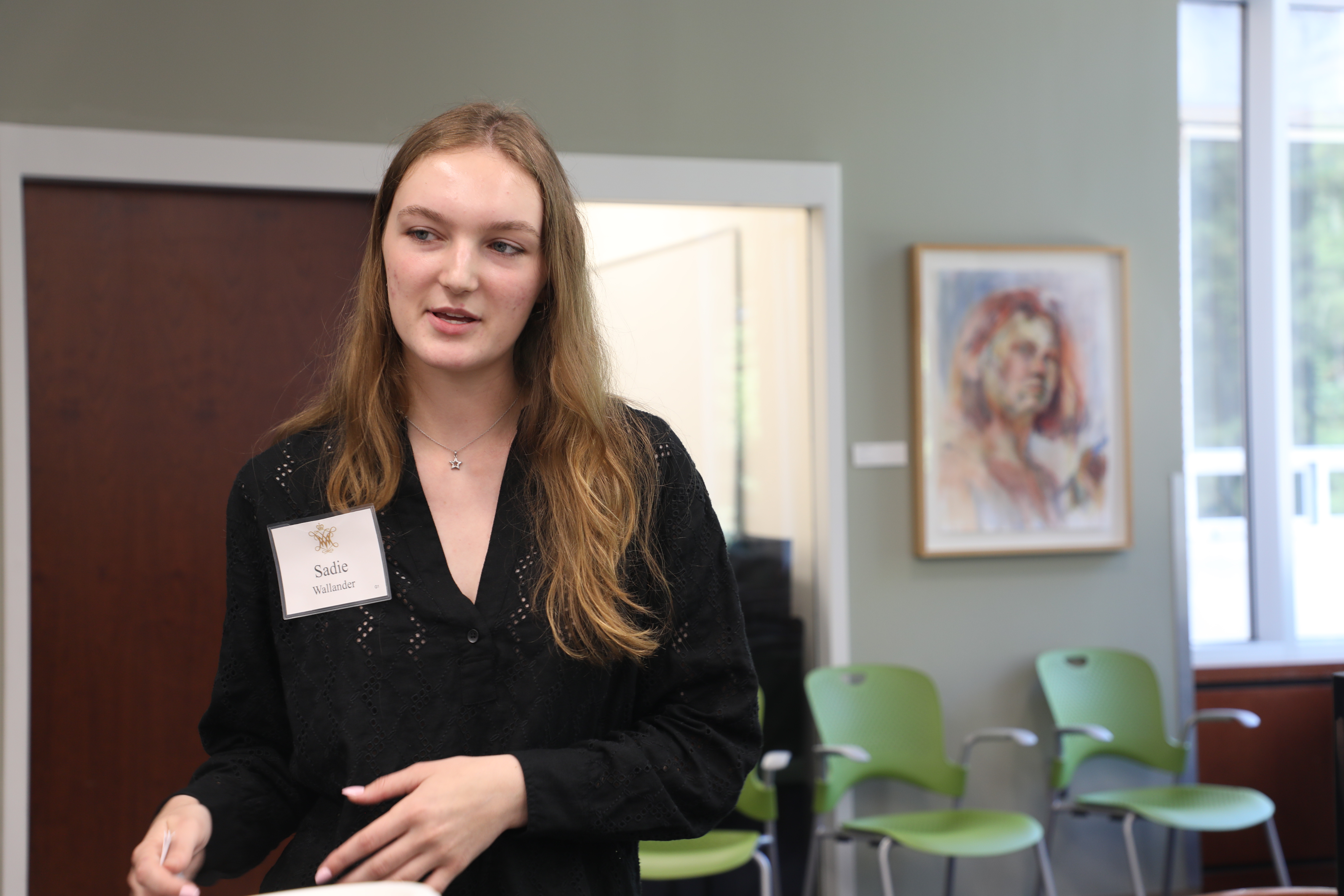 Sadie Wallander '28 presents her summer research at the Charles Center's Fall Undergraduate Research Symposium held in Swem Library Sept. 19. (Photo by Adeline Steel)