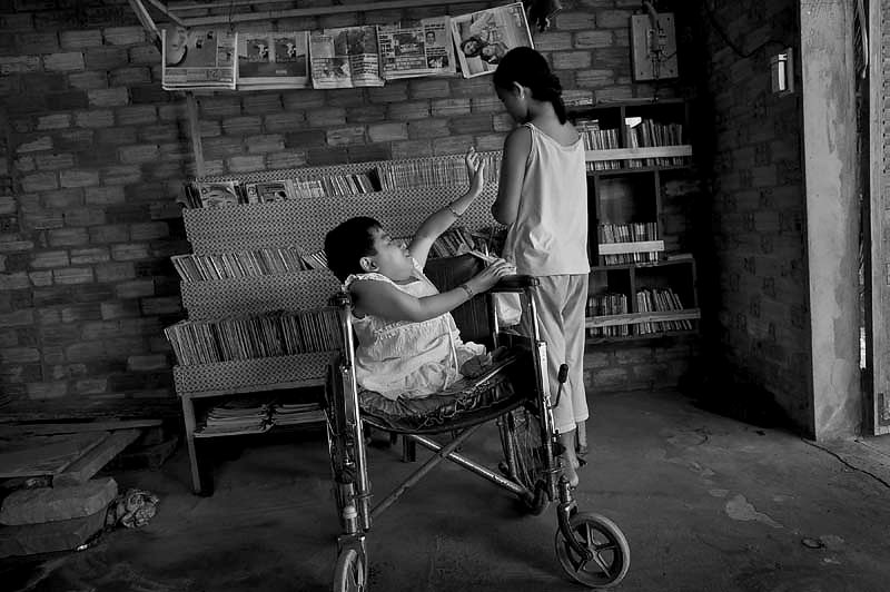 Virginia-Pilot staff photographer Stephen M. Katz served as director of photography for the critically acclaimed documentary "Thao's Library," now showing on Netflix. (Photo by Stephen M. Katz; reprinted with permission by Virginia Media)