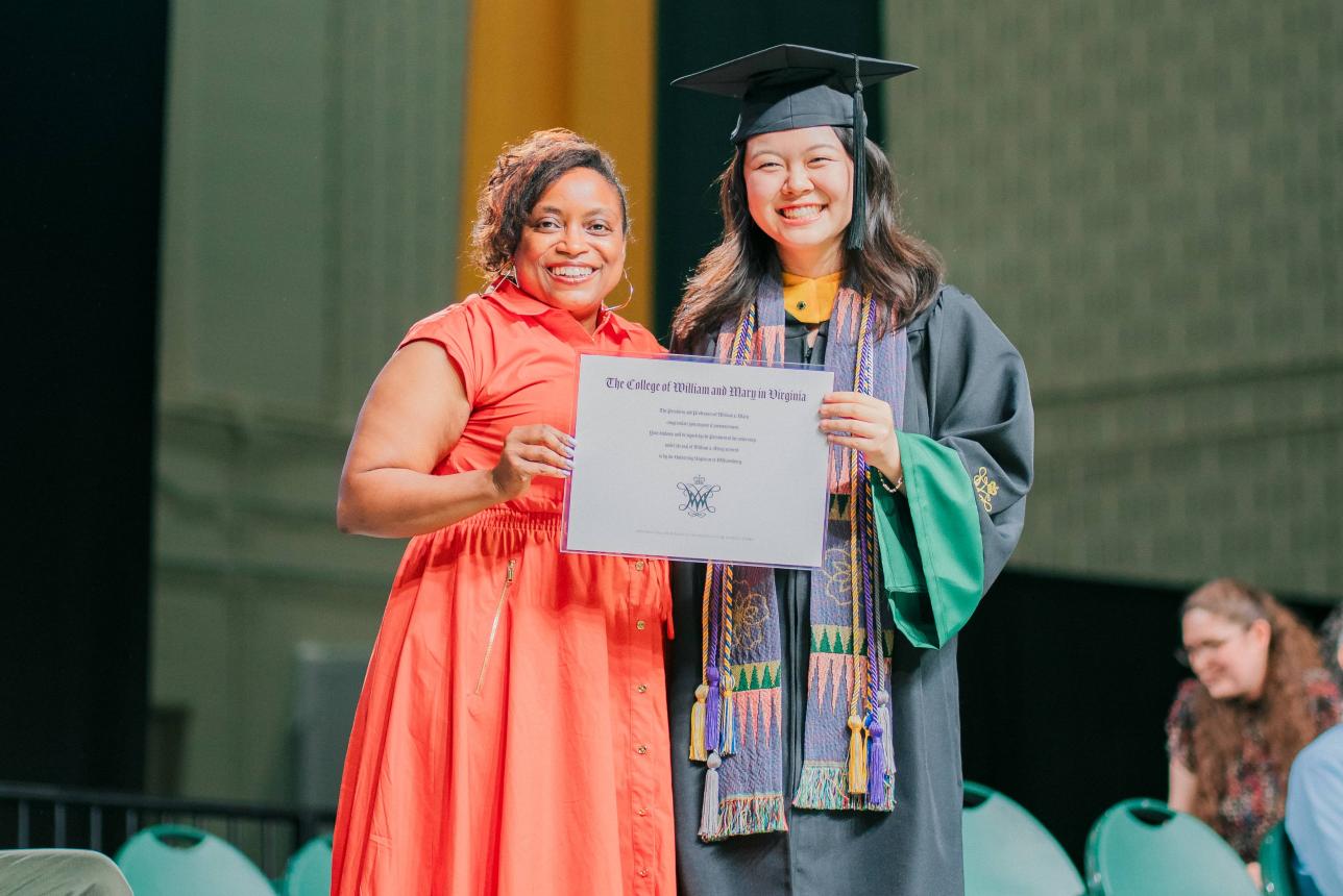 Connie Ryu '25 (right) marks her graduation from W&M last May with her mentor, Professor of Biology Shantá Hinton (left). (Courtesy photo)
