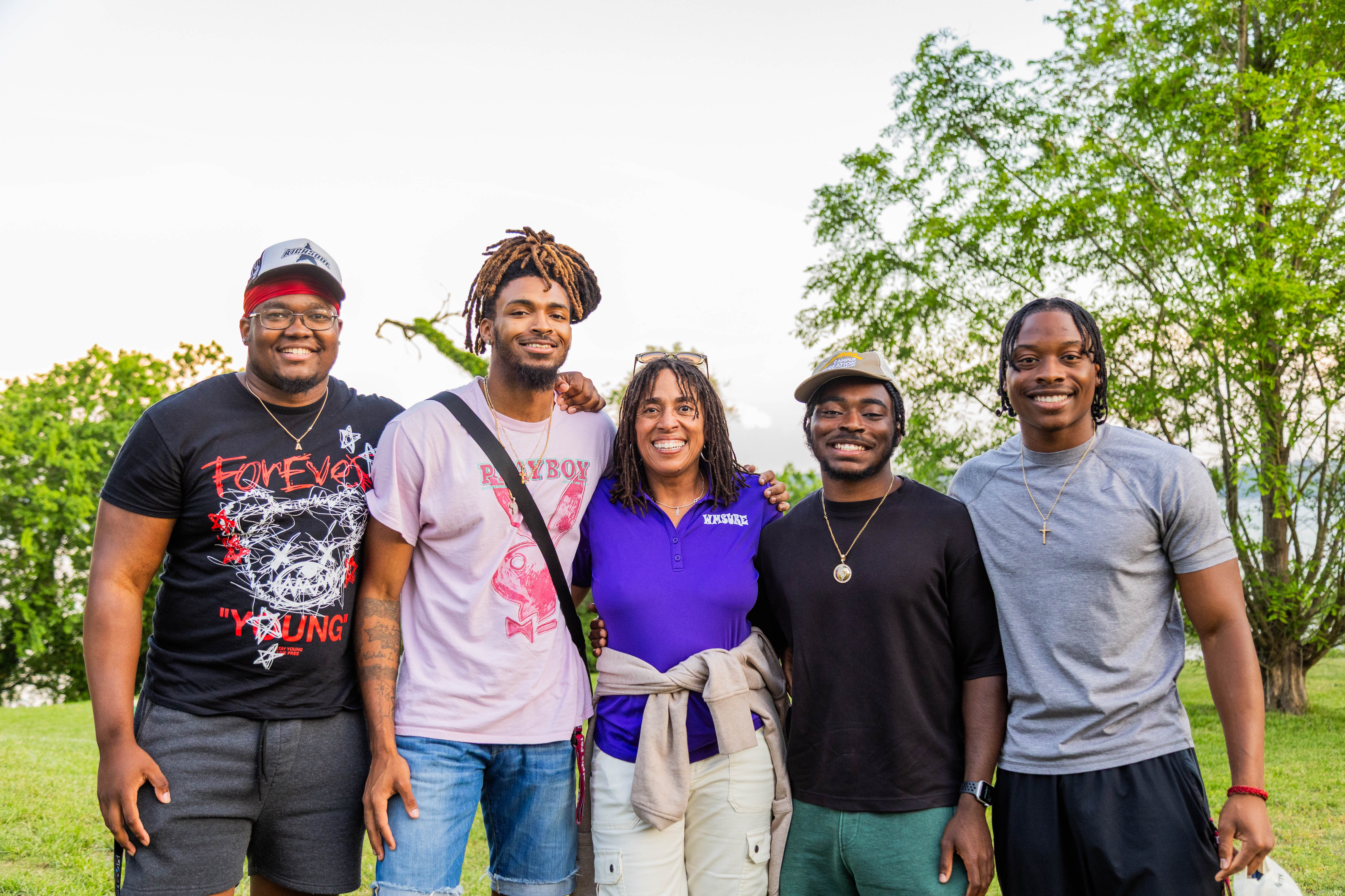 Adriek Gill '25, Devon Oliver '25, WMSURE Co-Director Iyabo Osiapem, Talik Bryant '25, and Donald Torrey, Jr. '25 (left to right) come together during the WMSURE end of year celebration April 30 at the Batten School, Virginia Institute of Marine Science. (Photo by Tess Willett)
