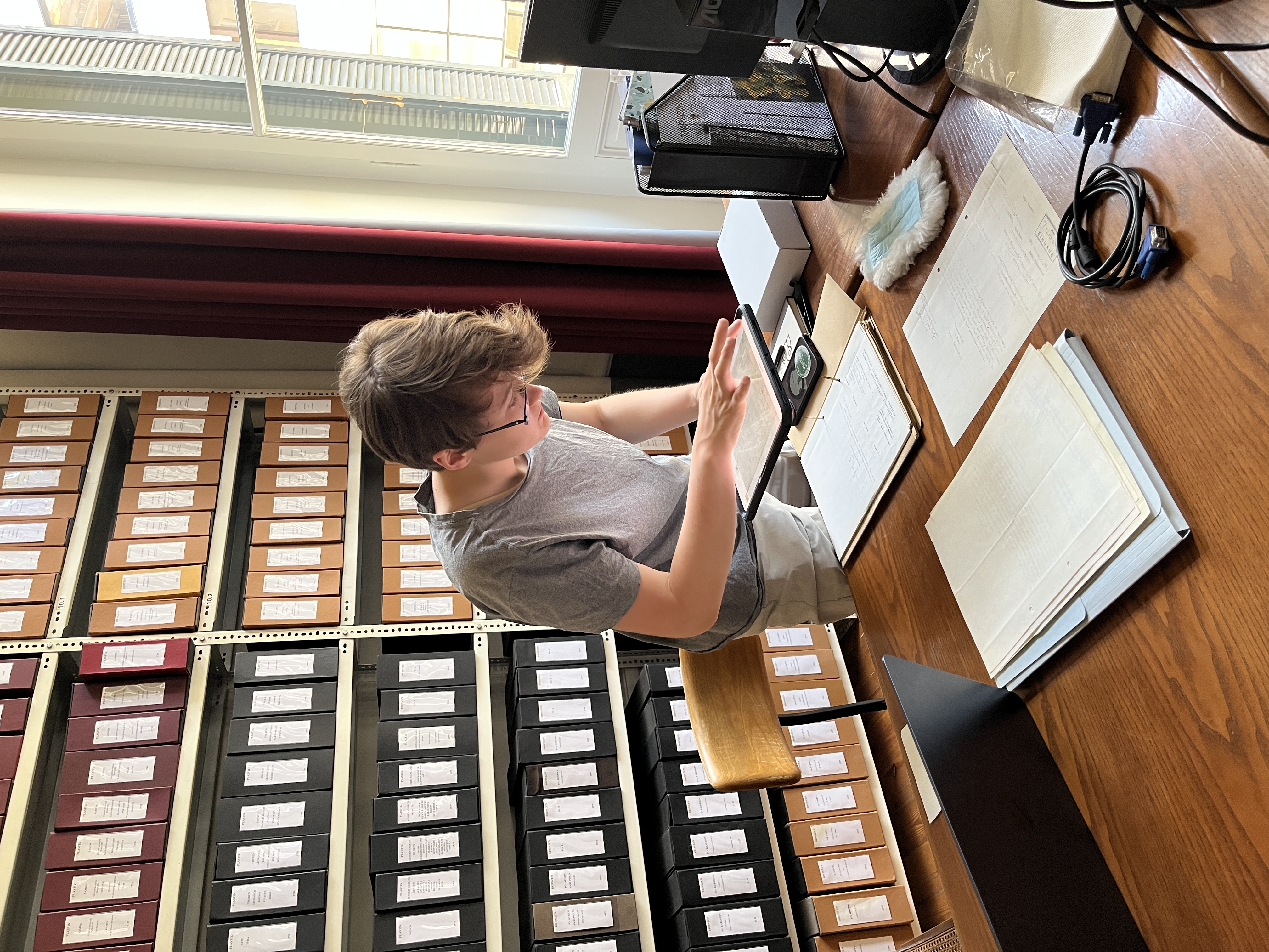 Devon digitizing archival letters at the German Archaeology School (photo by Jess Paga)