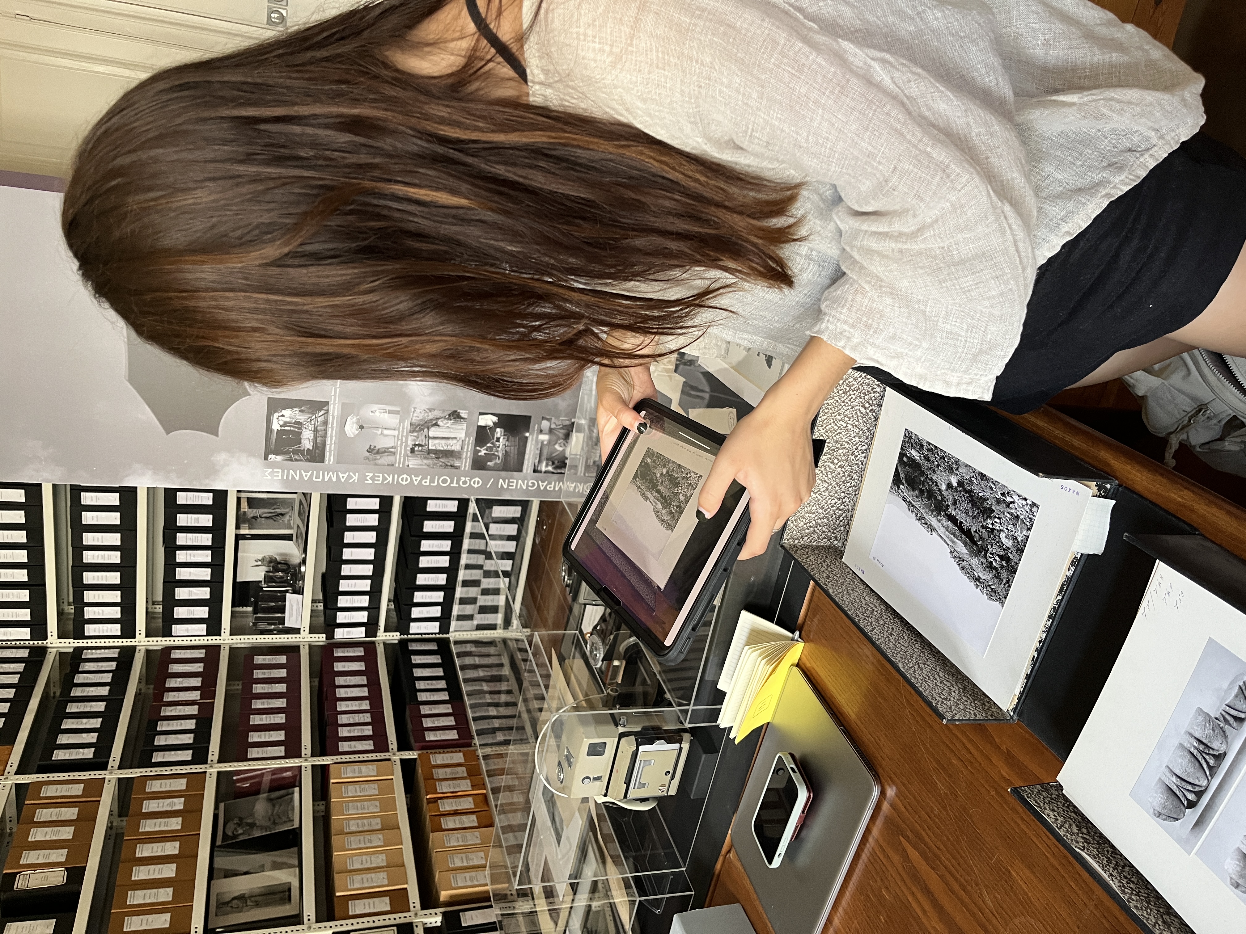 Maya digitizing archival photos at the German Archaeological School (photo by Jess Paga)