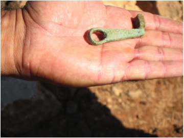 A bronze key found in under Opus Cammunticeum and near the wall