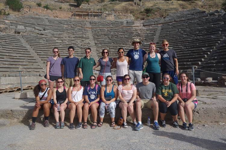 Students with Prof. Panoussi in the theater at Delphi