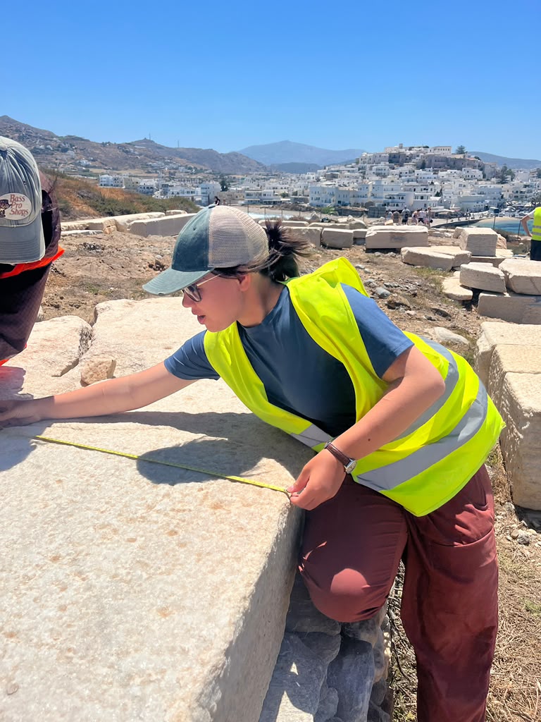Paige measuring rock