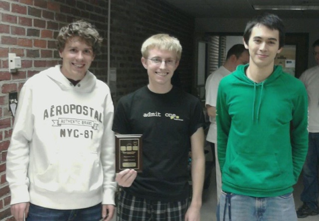Team 1 (William & Mary Gold) holding their first-on-site plaque.  From left to right, Aaron Dufour (2012), Brett Cooley (2013), and Michael Christensen (2011).