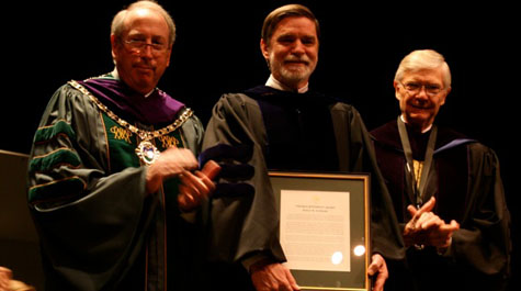 Bob Archibald received the Thomas Jefferson Award on Charter Day from Henry C. Wolf, '64, Rector of the Board of Visitors, and W&M President, Taylor Reveley.