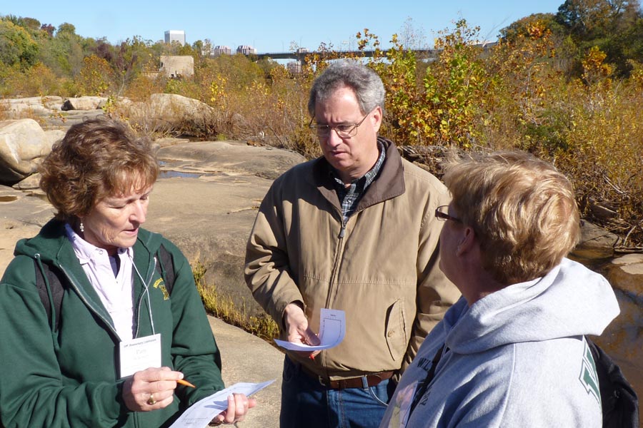 Pam Wilkinson ('76), Jim Firebaugh ('74), and Debbie Firebaugh consider the Depth-Time-Temperature profile of the Petersburg Granite