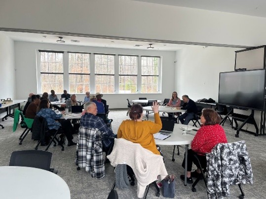 Focus group participants offering input at Impact Center Discussion.