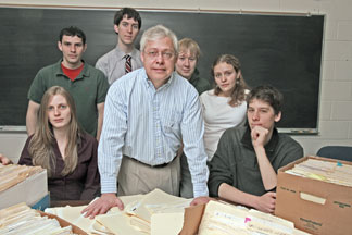Whip-count researchers (from left) Jessica Lane, Ricky Trotman, Walter McClean, Josh Litten, Larry Evans, Lauren Merrill and Brent Schulties pose with some of their research files.