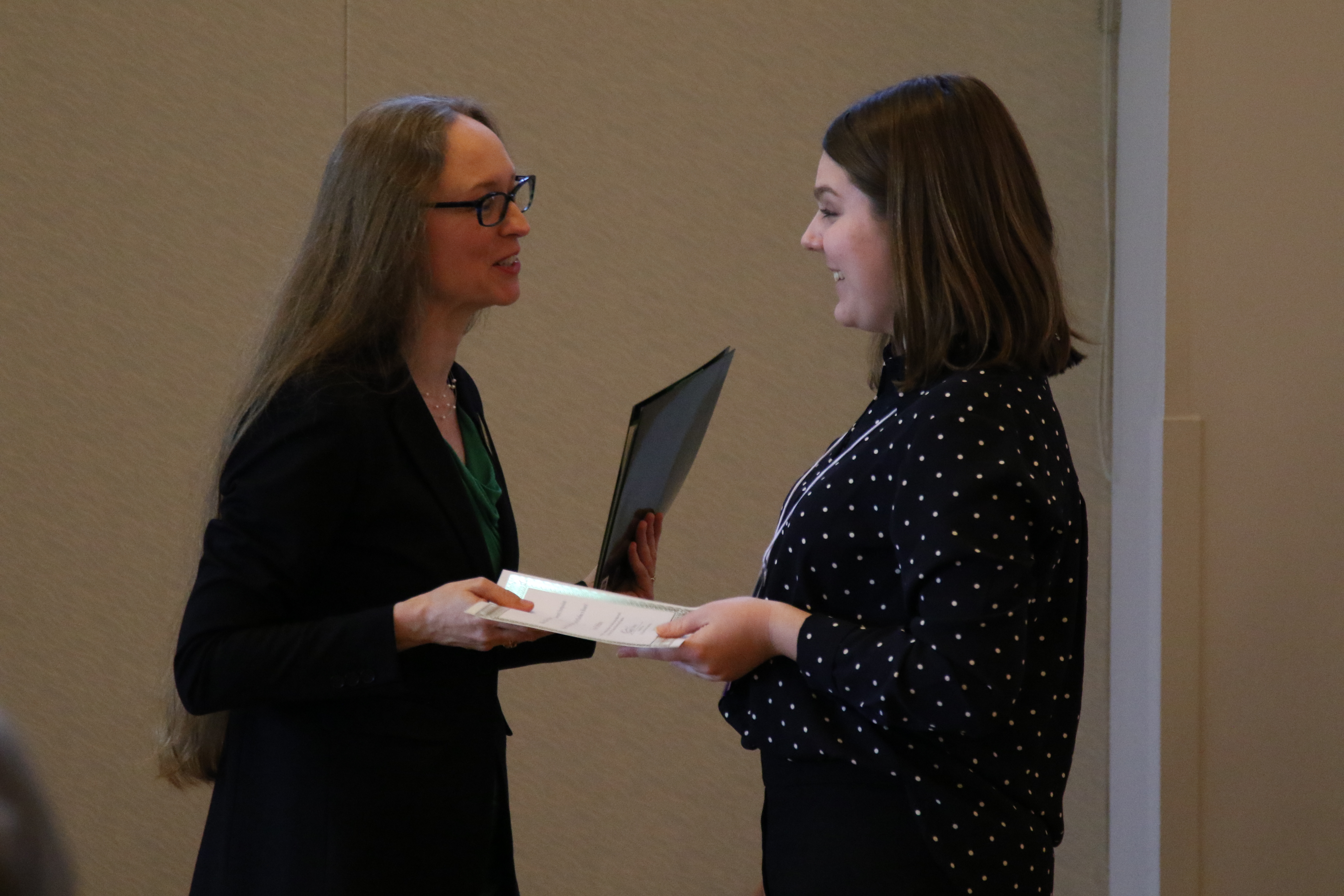 Pictured: Grace DeSalvo, top award winner, accepts certificate from Sarah Glosson, Director of the Arts & Sciences Graduate Center