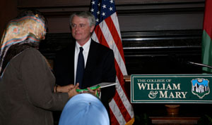 Gene Tracy, Interim Dean of Arts & Sciences, presents the signed Fanfare score to Minister al-Busaidiyah.