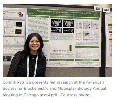 Connie Ryu '25 stands in front of her poster, presenting her research.