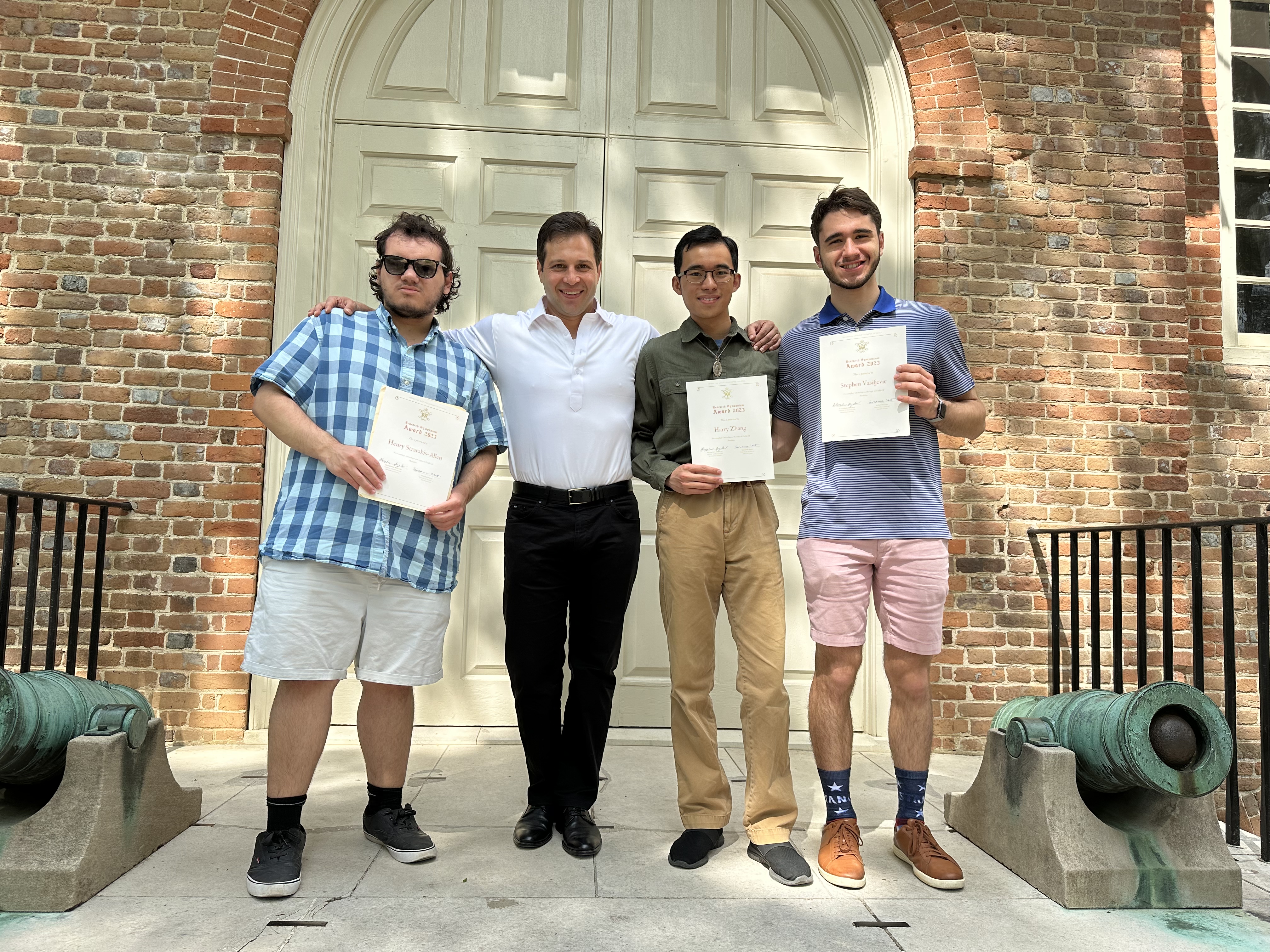This year's award recipients (from left to right), Henry Stratakis-Allen, Harry Zhang, and Stephen Vasiljevic stand outside the Wren Building with Dr. Alexander Angelov, Director of the Medieval and Renaissance Studies Program.
