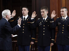 Gates swears in lieutenants at ROTC affirmation ceremony during commencement weekend. By Stephen Salpukas.