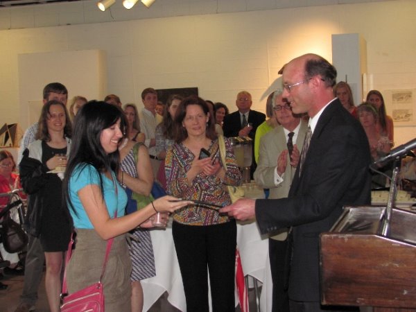 Linsdey Schlieffer receives her Excellence in Neuroscience Award from Dr. Josh Burk