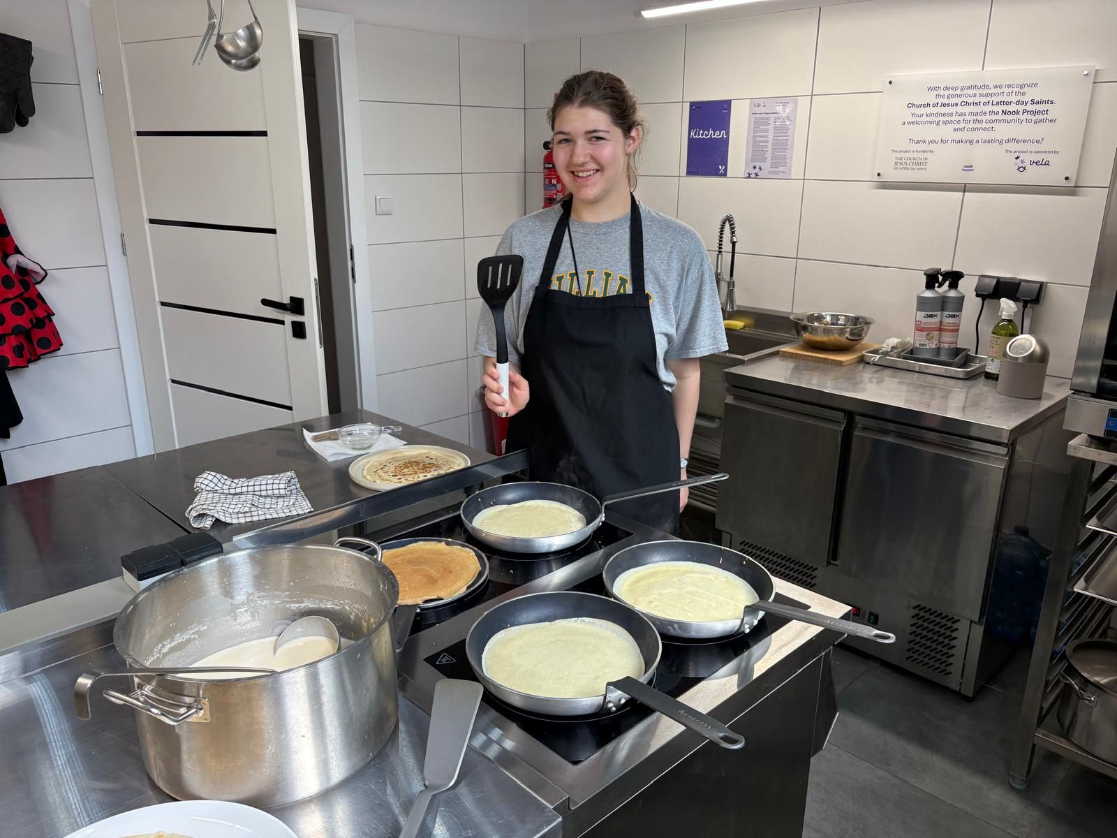 Celeste Edwards ‘28 prepares food for the Ukrainian children at Freedom Space in Kraków, Poland. Photo courtesy of Celeste Edwards. 