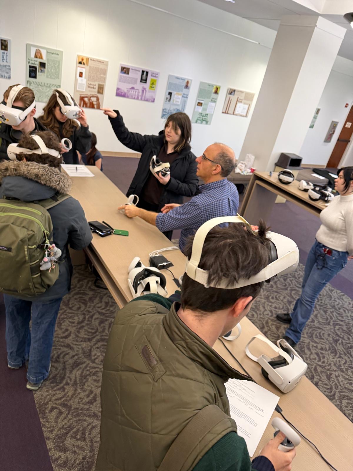 Visitors to the "War Up Close” exhibition explore the virtual reality devices in Swem Library. Photo courtesy of Alexander Prokhorov.